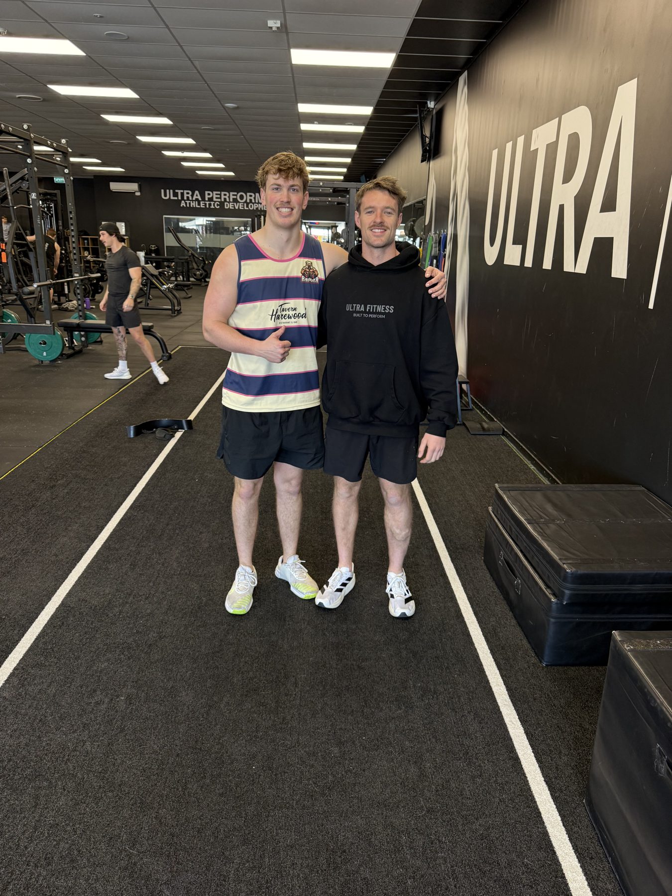 Two members on the turf after a session