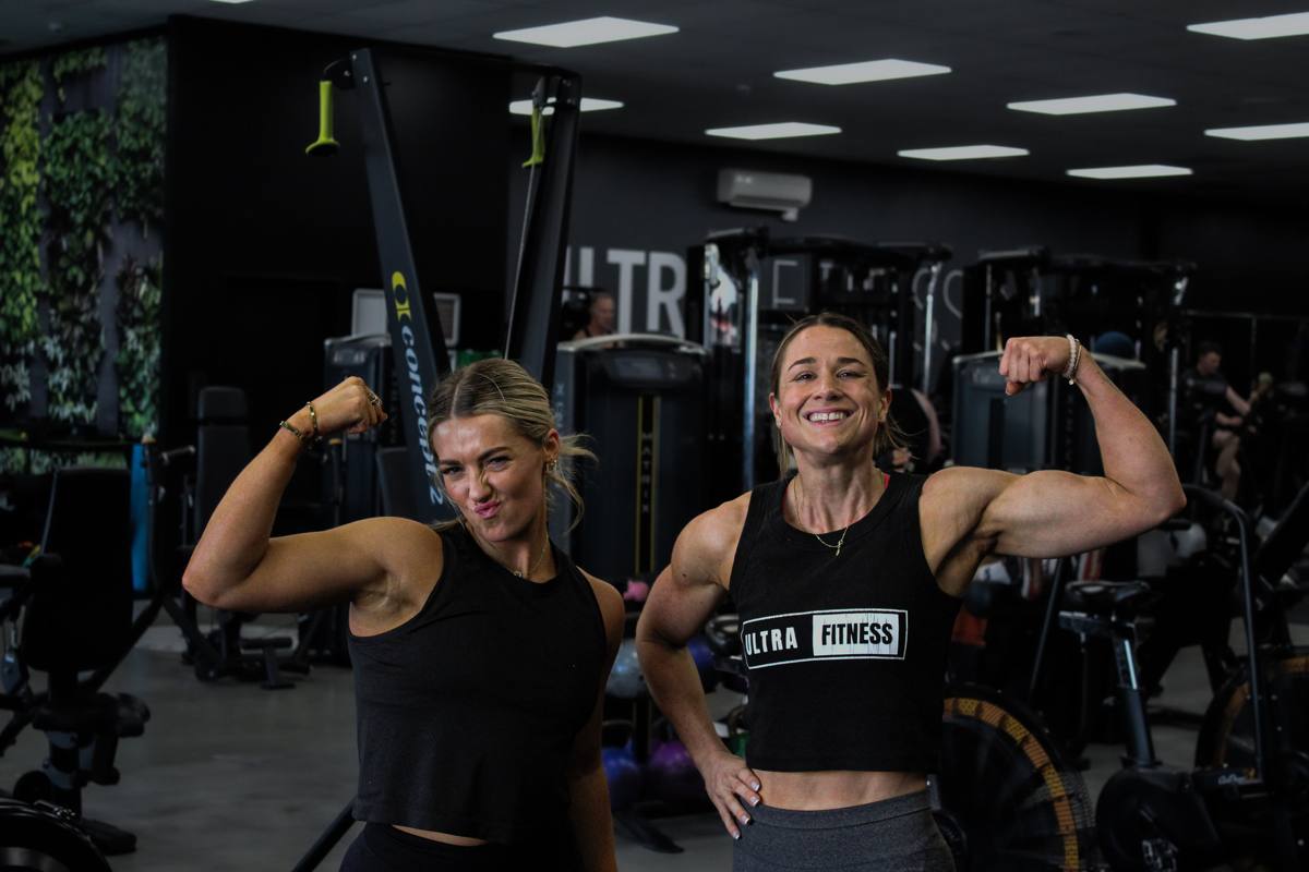 Two members training together on the Ultra Fitness floor