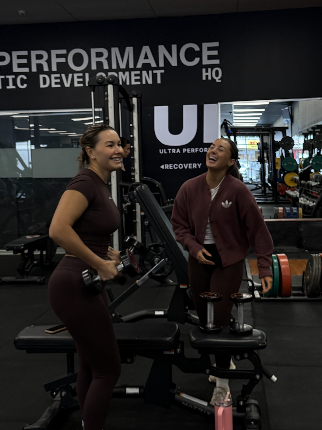 Two members laughing between sets